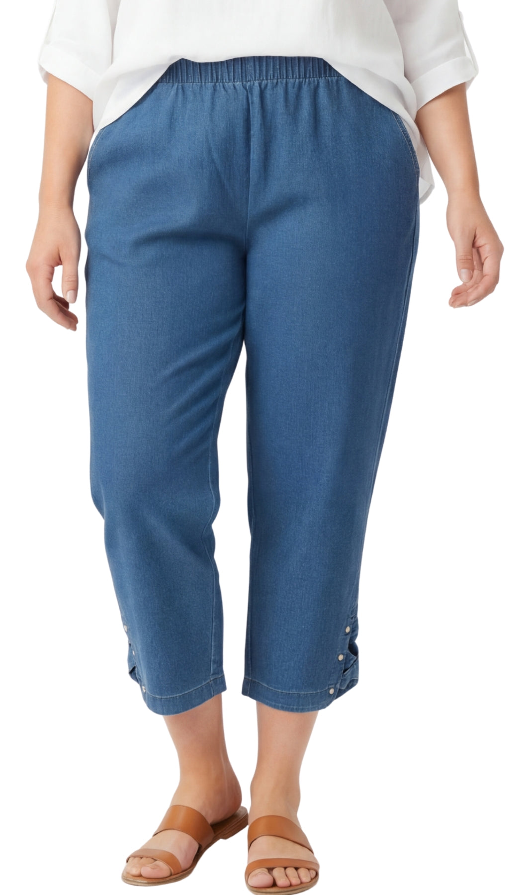 Blue capri pants worn by a person on a white background