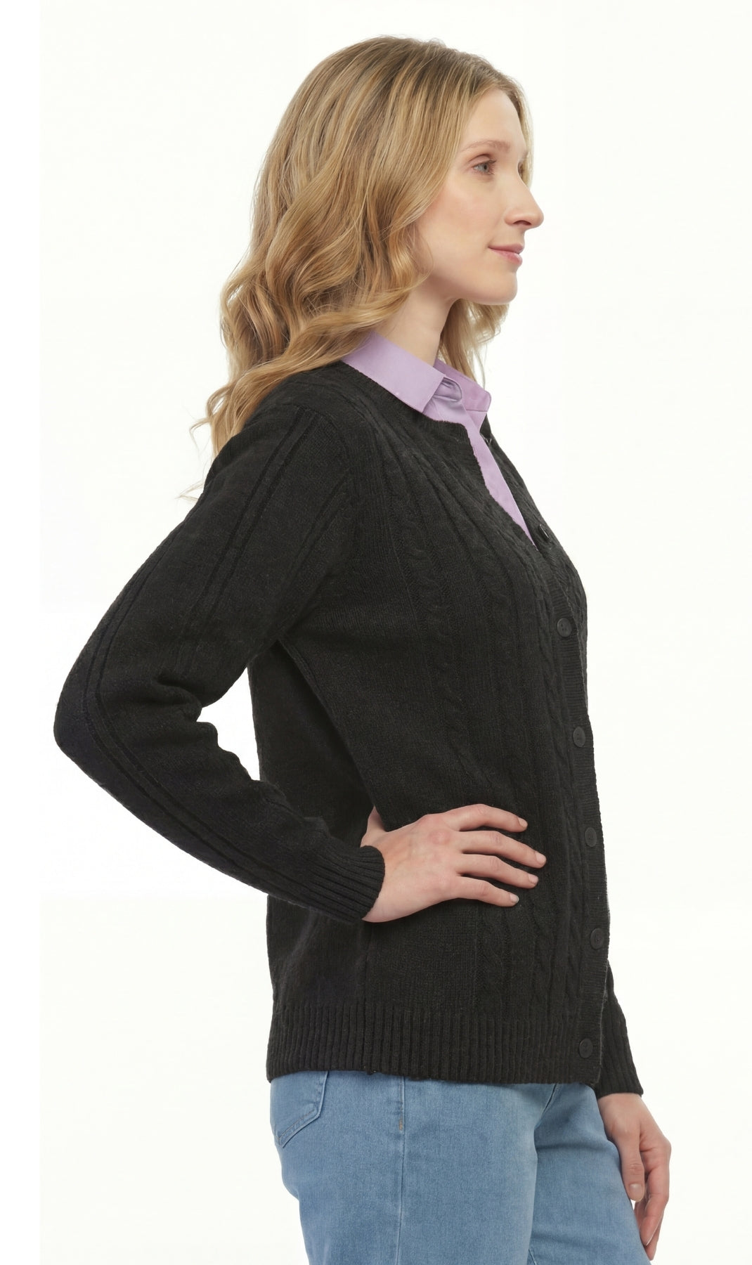 Woman wearing a black cardigan over a light purple shirt with a white background