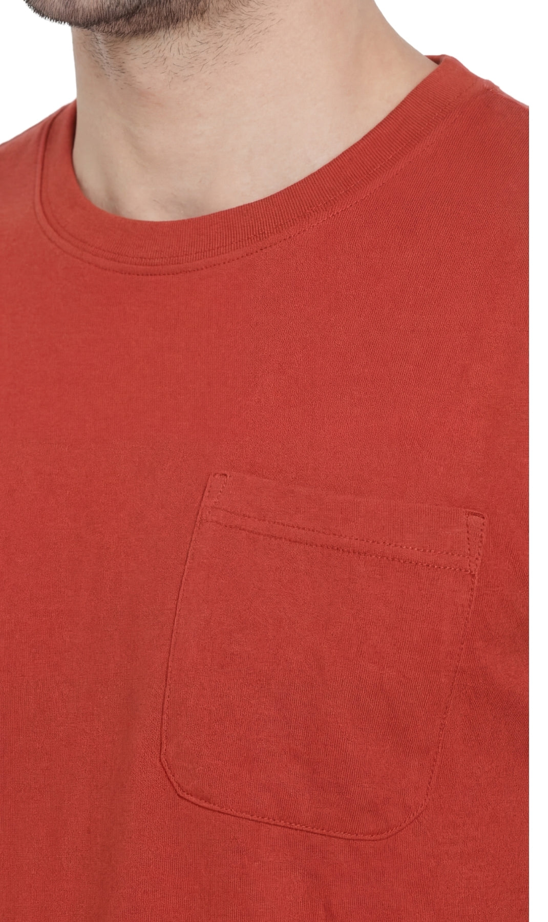 Close-up of a red t-shirt with a pocket on a white background